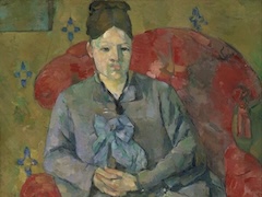 Madame Cezanne in a Red aAmchair by Paul Cézanne